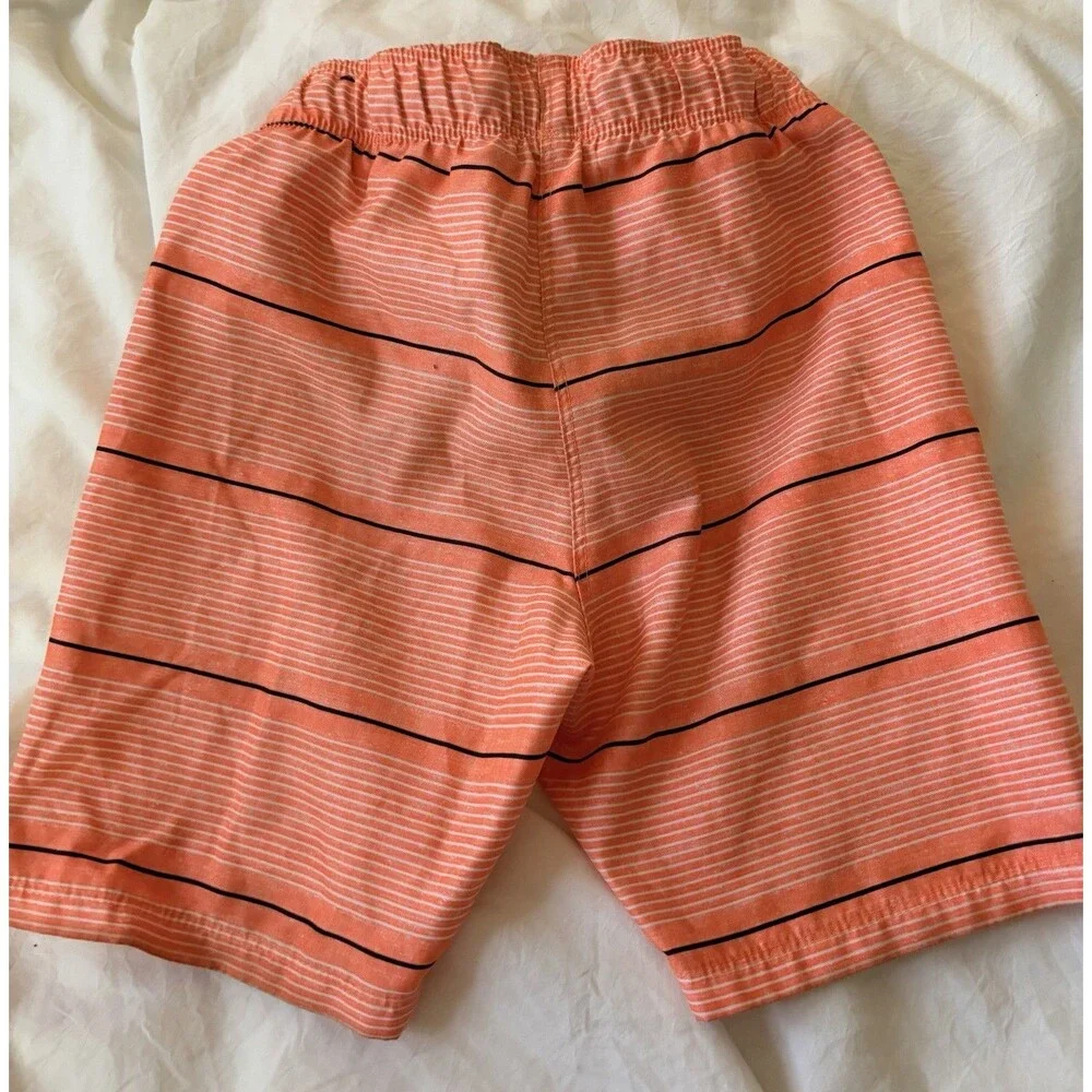 Hurley boys orange stripe swim trunks, size 5/6, with black accents